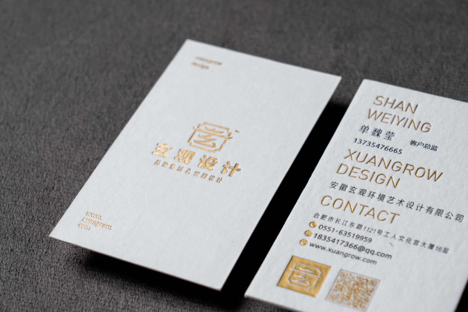A wider view of the same pale gold-crest cards, showing both vertical faces.