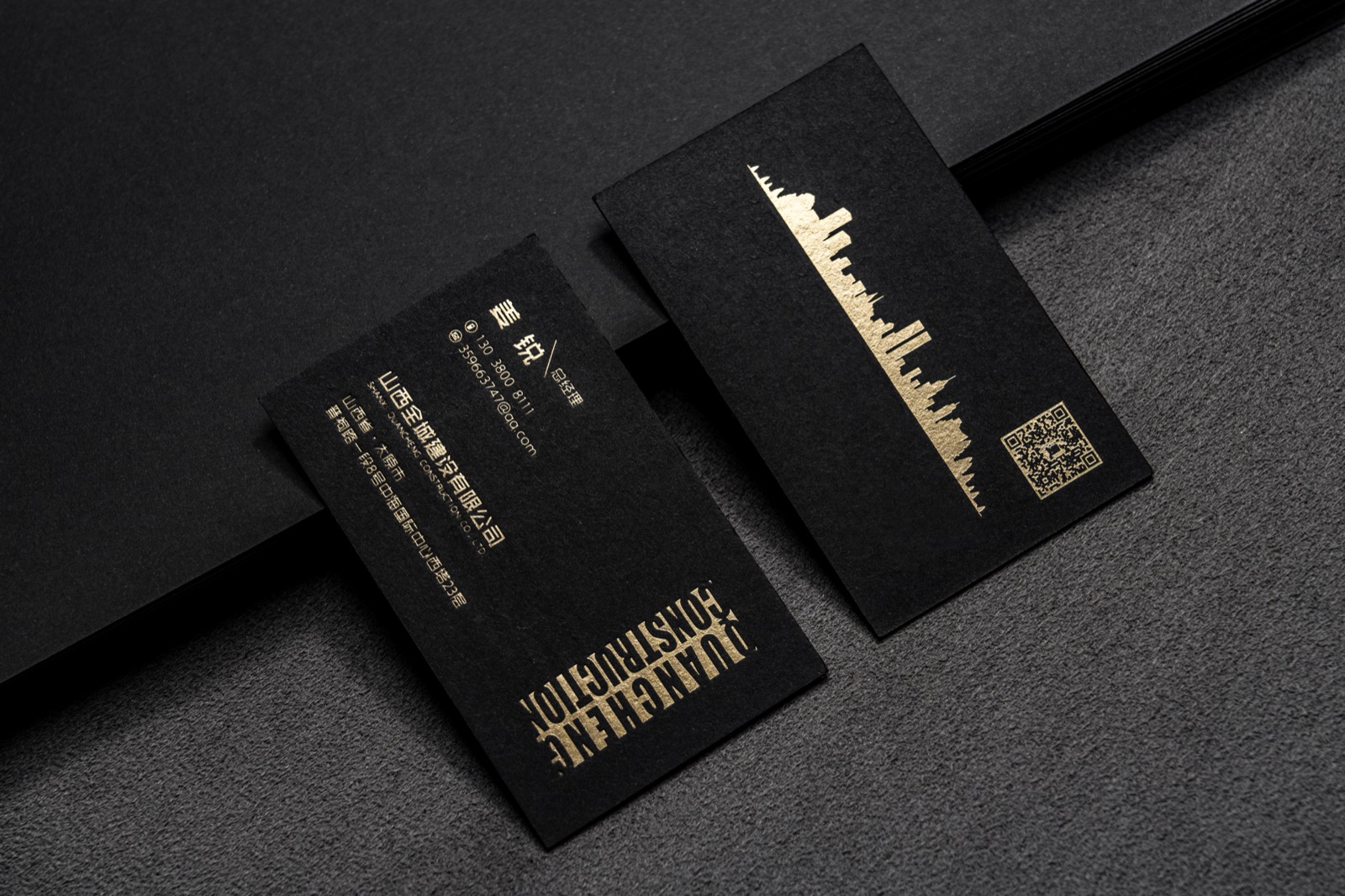 Vertical dark cards with a gold skyline-like illustration and matching text.