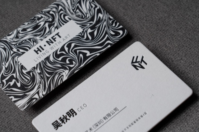 A black-and-white card pairing with dense swirling lines on one face.