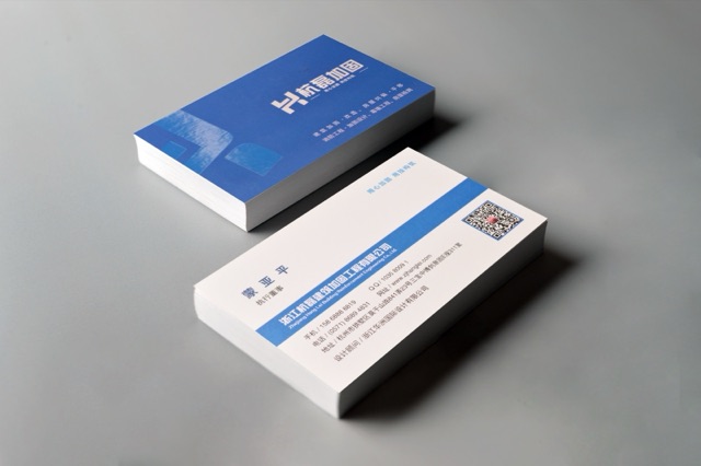 A blue-and-white card design shown as two substantial stacks.