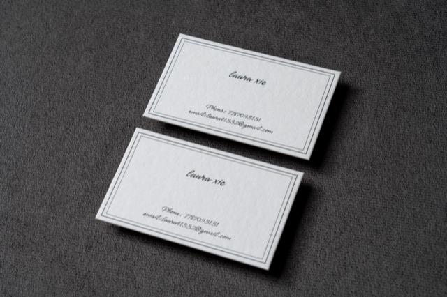 Two white cards with thin rectangular borders and centred black lettering.