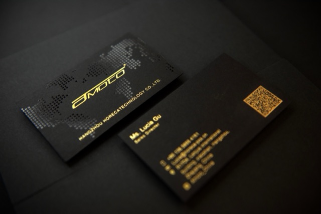 A dark card pair with a gold wordmark and faint patterned linework.