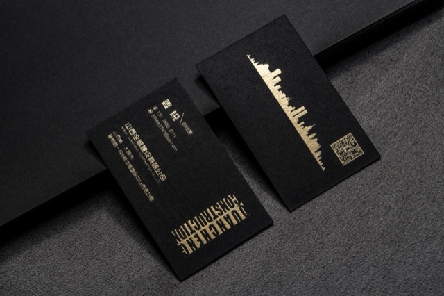 Vertical dark cards with a gold skyline-like illustration and matching text.