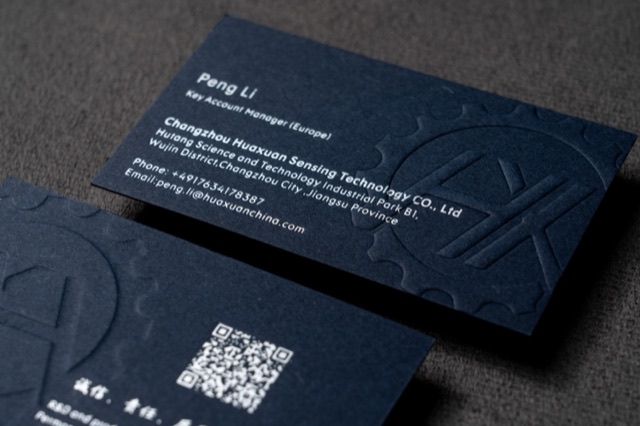 Navy cards with large tone-on-tone curved linework and pale contact text.
