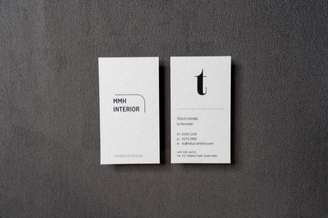 Two tall white cards arranged side by side with restrained black typography.