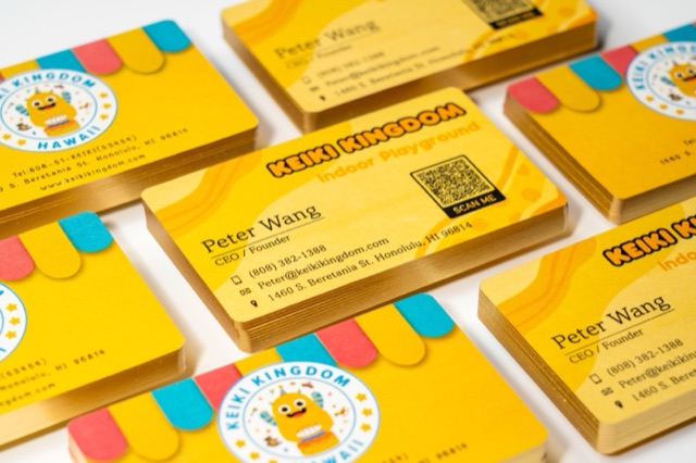 Several bright yellow card stacks with illustrated colour blocks and black text.