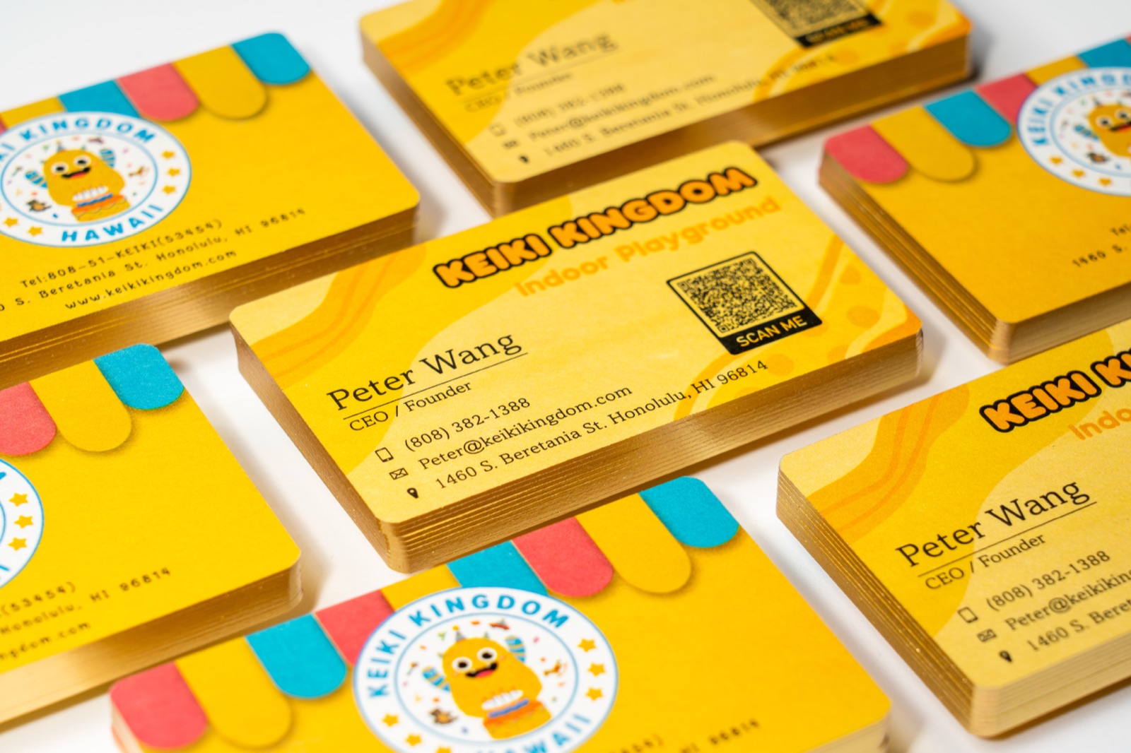 Several bright yellow card stacks with illustrated colour blocks and black text.