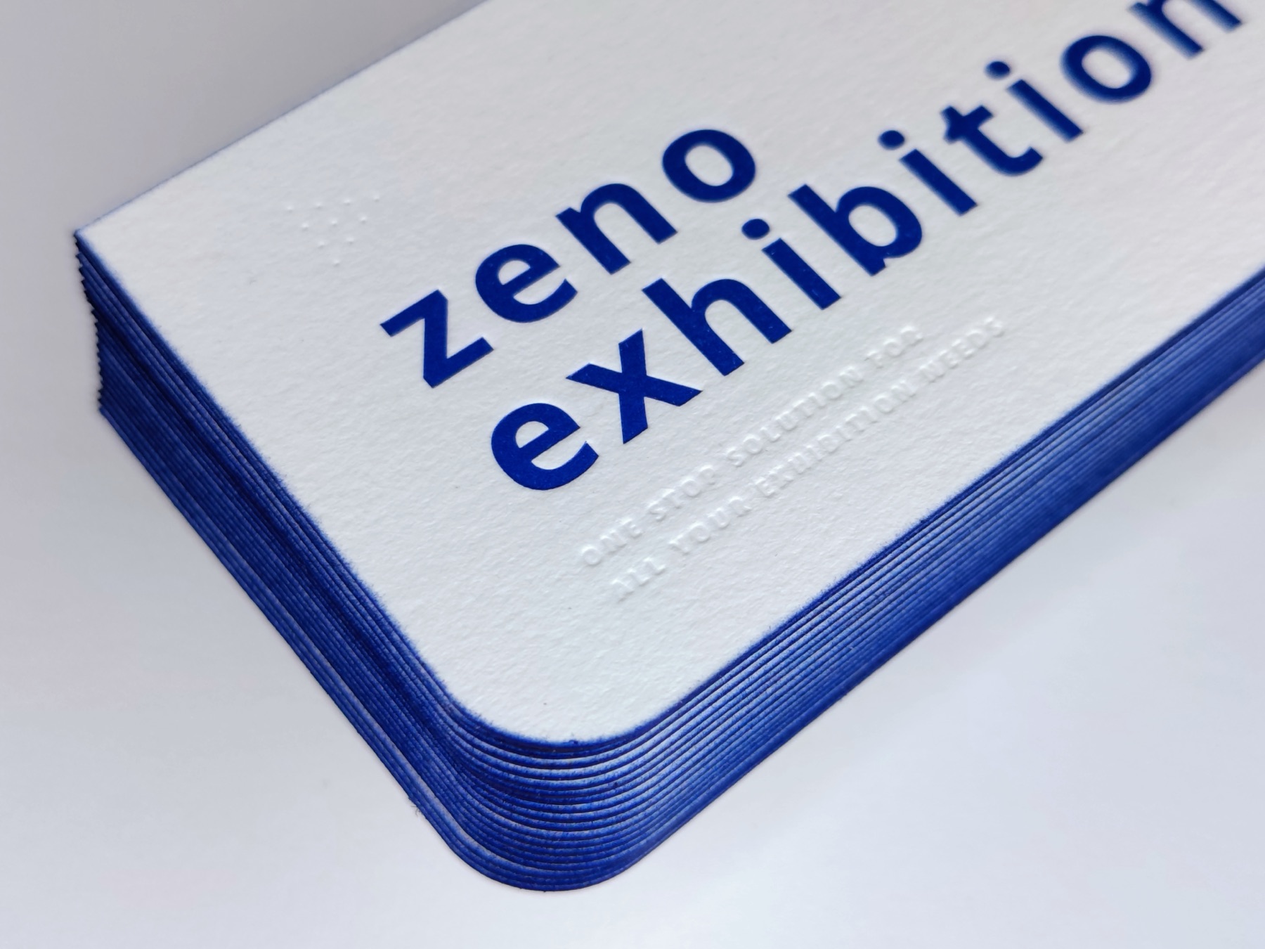 Stack of white cards with deep blue edges