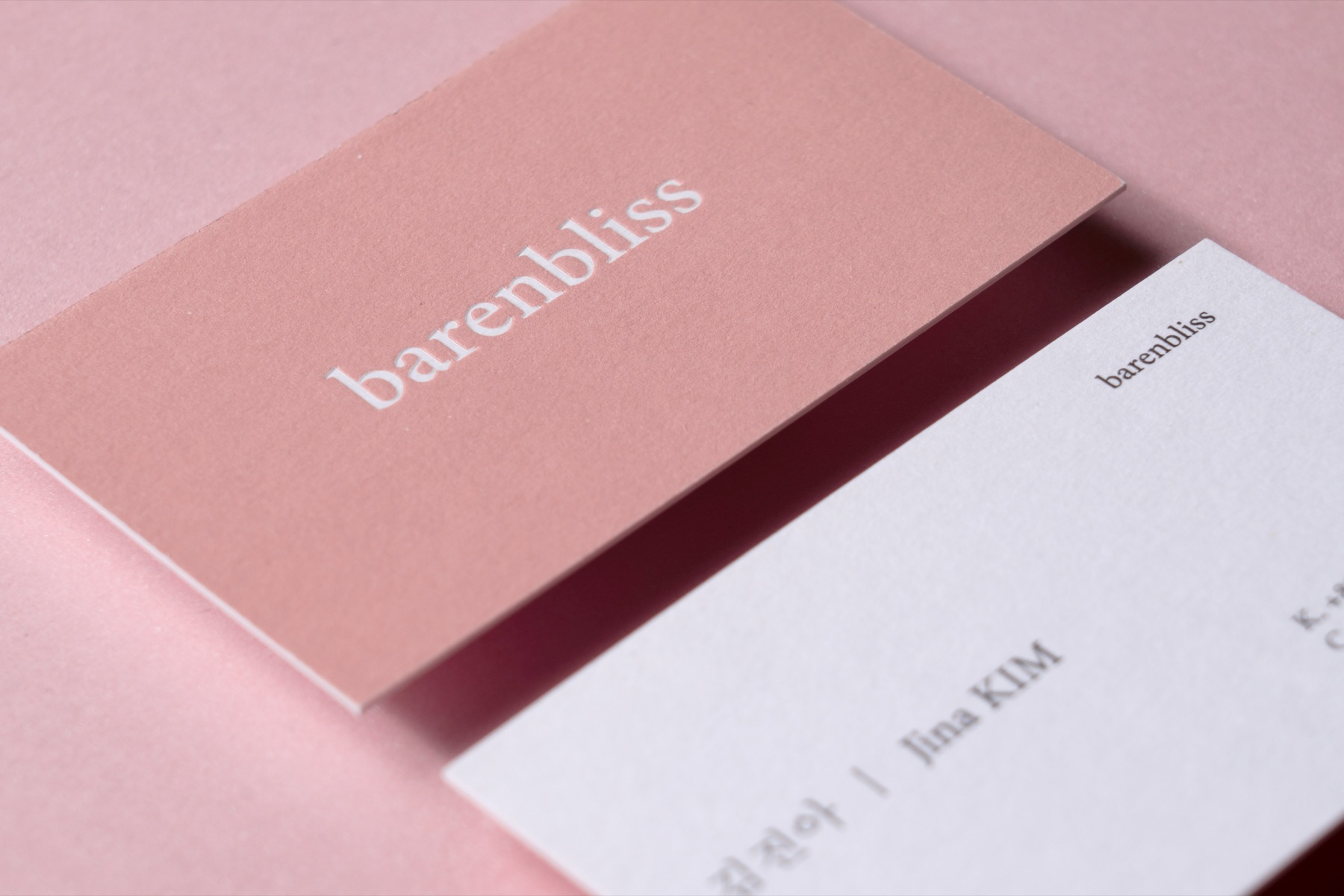 Blush card with white typography